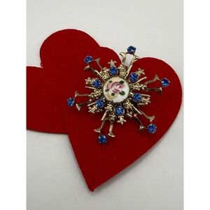 Gold-toned rhinestone starburst brooch floral enamel design blue rhinestones.‎